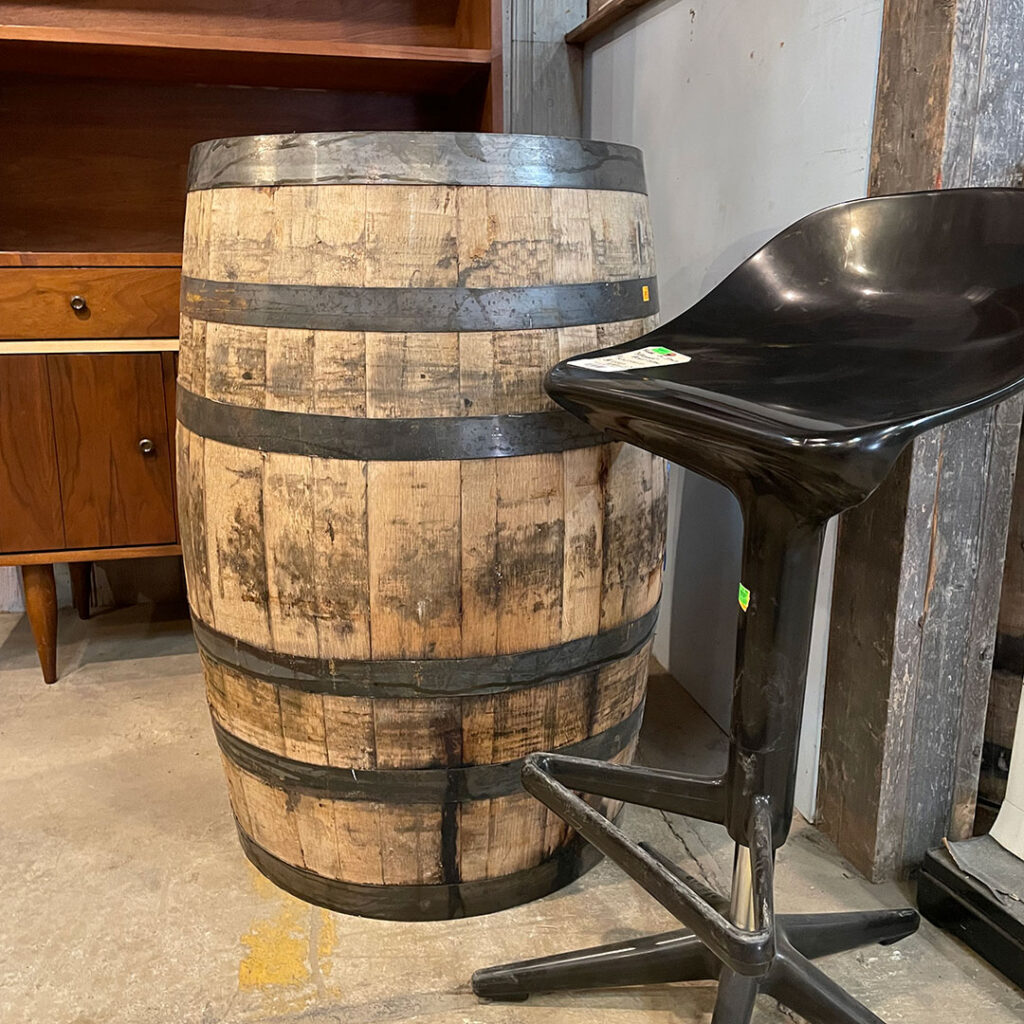 a single barrel being used as a bar table